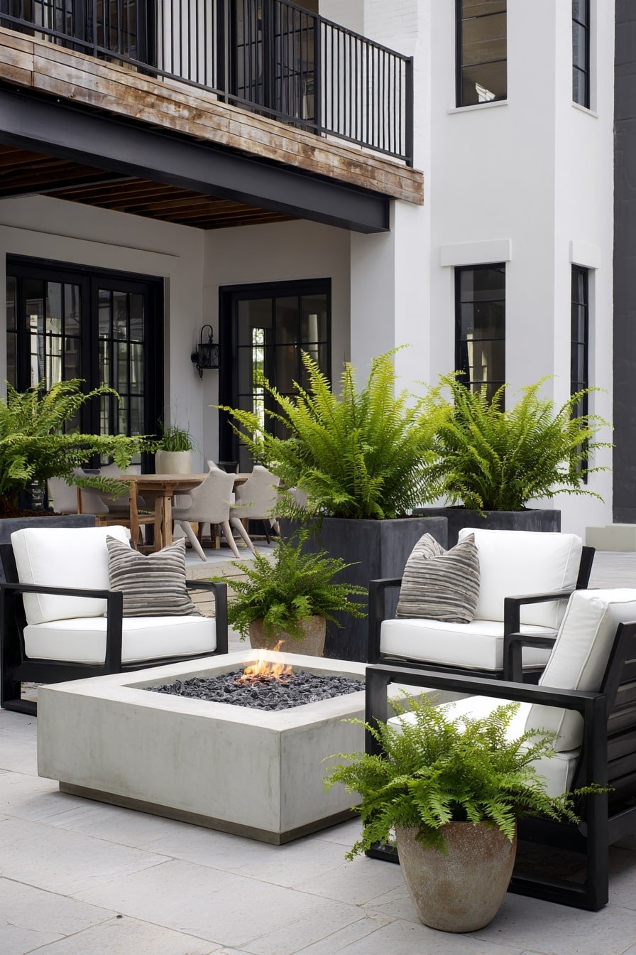 Surround a Sleek Fire Pit with Lush Potted Ferns for Contrast